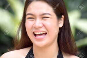 A Pretty Filipina Female And Laughter