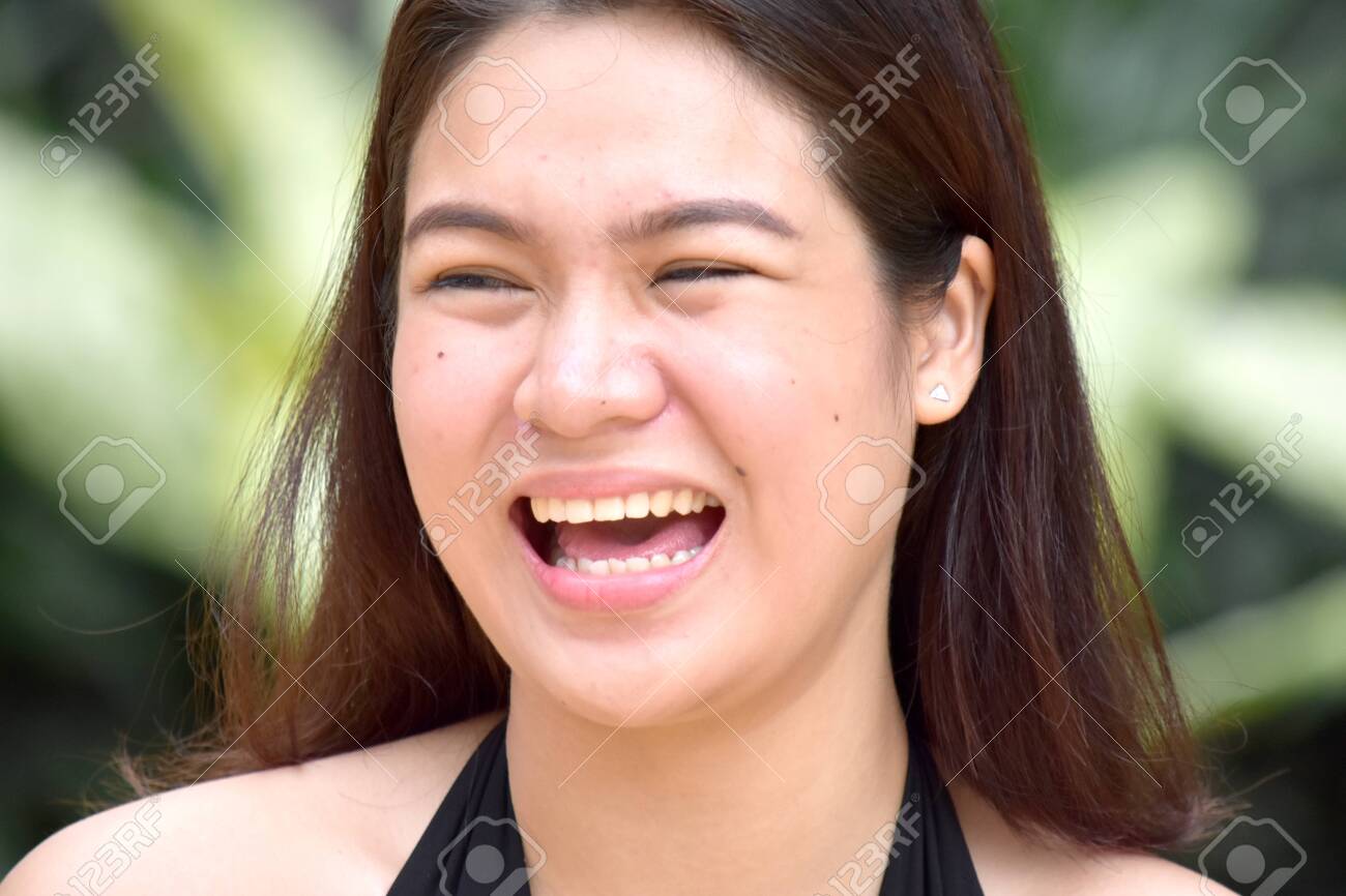 A Pretty Filipina Female And Laughter